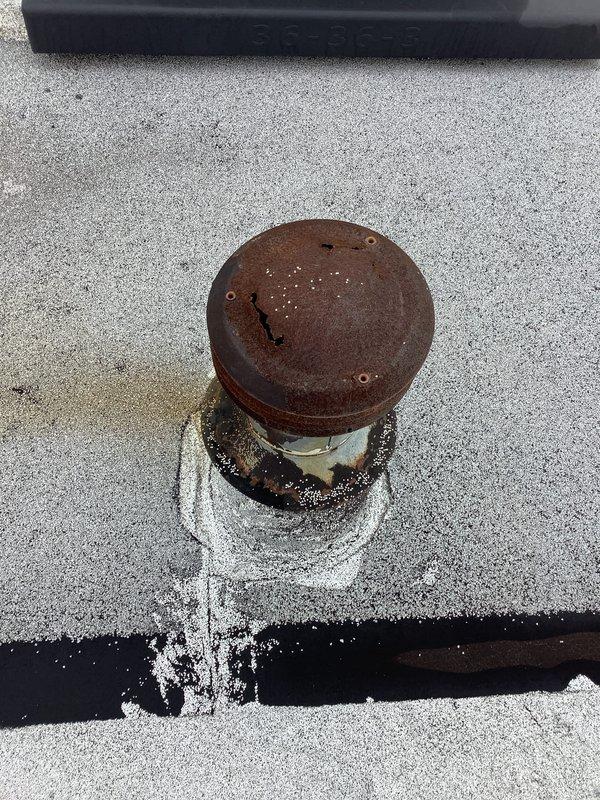 Responded to commercial RTU service request regarding excessive gas consumption. Inspected electrical sub-panel and found proper circuit connections. Discovered significant rust and mineral deposits around roof vent pipe indicating possible water infiltration, which may contribute to system inefficiency or heat loss requiring further investigation.