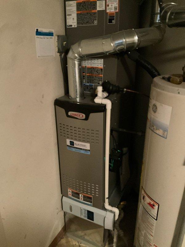 Performed annual BFMA tune-up on 11-month-old Lennox furnace system. Inspected filter showing moderate dust accumulation but still functional; examined ductwork connections, condensate drainage system, and verified proper installation of PVC venting. All components operating within manufacturer specifications with no issues detected.