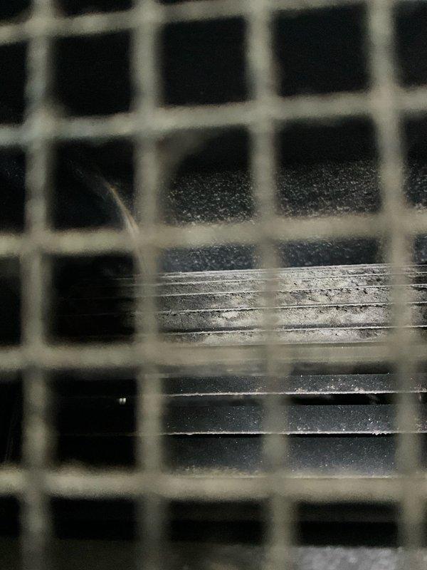 Diagnosed PTAC wall unit with no heat operation. Upon inspection, found dust accumulation on heat exchanger coils behind protective mesh screen. Cleaned heat exchanger and verified proper heating function before completing service.