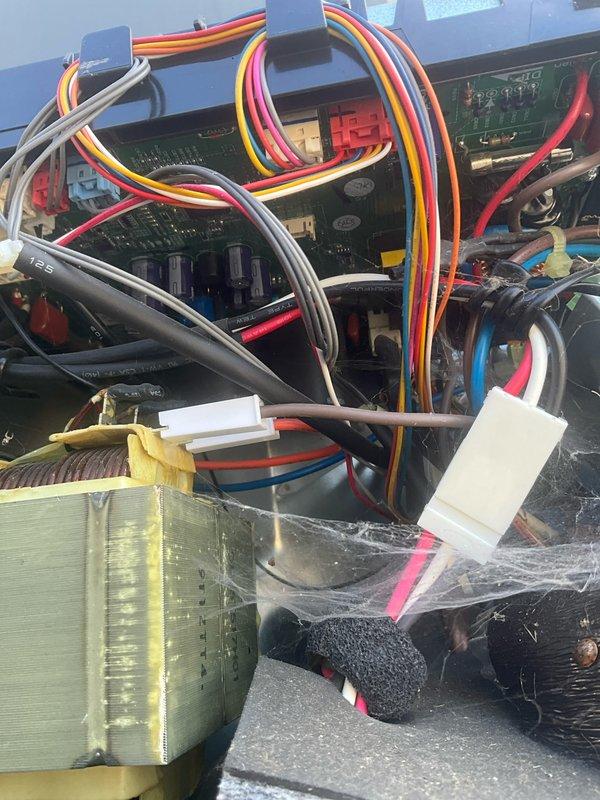 Responded to no-heat call for downstairs furnace and mini-split in four season room. Inspection revealed significant dust and cobweb accumulation inside furnace control board connections and wiring, requiring thorough cleaning. Outdoor unit showed severe weathering with dirt buildup and invasive plant roots growing into the electrical connection panel, which were removed to prevent system interference. Restored proper electrical connections and verified heat operation for both systems.