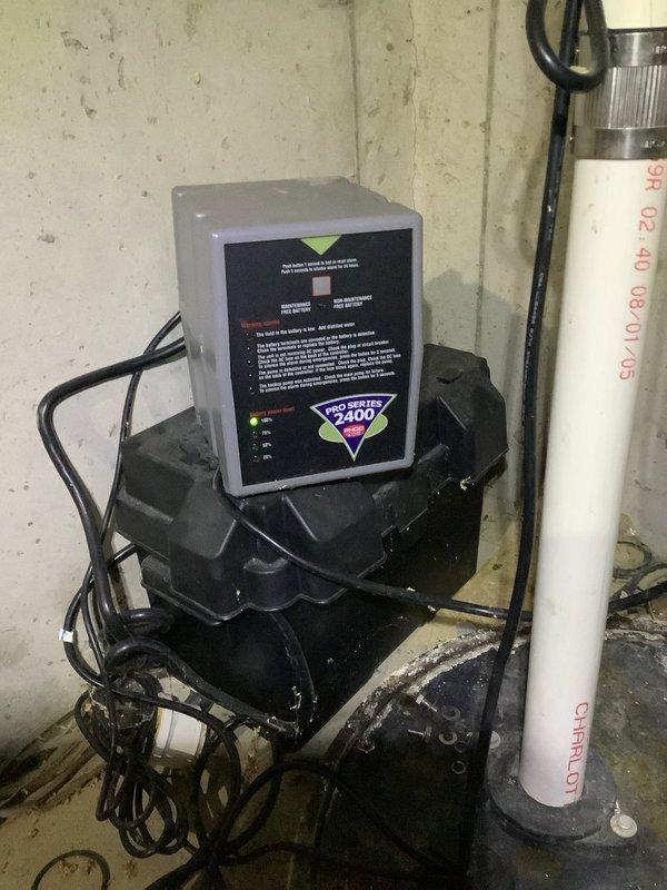 Responded to service call regarding beeping sump pump system. Upon inspection, found a Pro/400 control unit with corroded battery terminals affecting system function. Replaced batteries and cleaned terminal connections to restore proper operation of the backup warning system. Verified sump pump was functioning correctly after service.