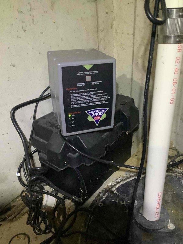 Responded to service call regarding beeping sump pump system. Upon inspection, found a Pro/400 control unit with corroded battery terminals affecting system function. Replaced batteries and cleaned terminal connections to restore proper operation of the backup warning system. Verified sump pump was functioning correctly after service.