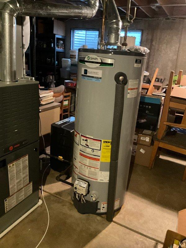 Performed comprehensive furnace tune-up including inspection of Smith water heater system and examination of Emerson control board circuitry. Verified all electrical connections were secure with proper wire routing, and confirmed system components were functioning within normal parameters with no evidence of damage or abnormal wear.
