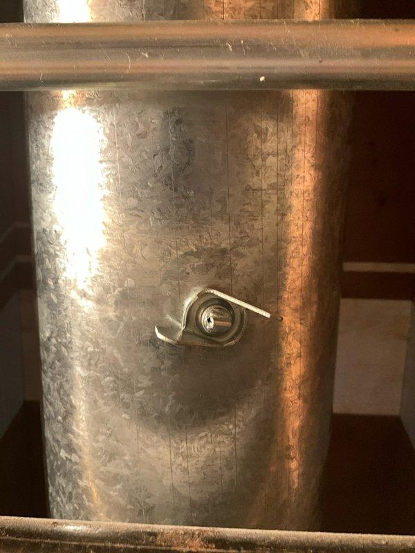 Installed custom air deflector extension on dining room vent to redirect airflow, allowing for proper window treatment installation while maintaining optimal heating performance. Secured connection points with wing-type cam locks to ensure stability and prevent air leakage. Solution addressed client's aesthetic concerns regarding the off-center vent placement that previously caused window drapery issues.