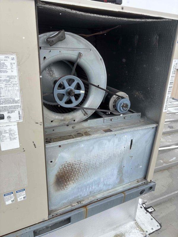 Successfully replaced the blower motor in a Lennox rooftop unit showing signs of wear and operational degradation. Removed existing motor assembly from the belt-driven squirrel cage system, installed new OEM component after parts acquisition from supplier, and verified proper operation of the restored HVAC system.