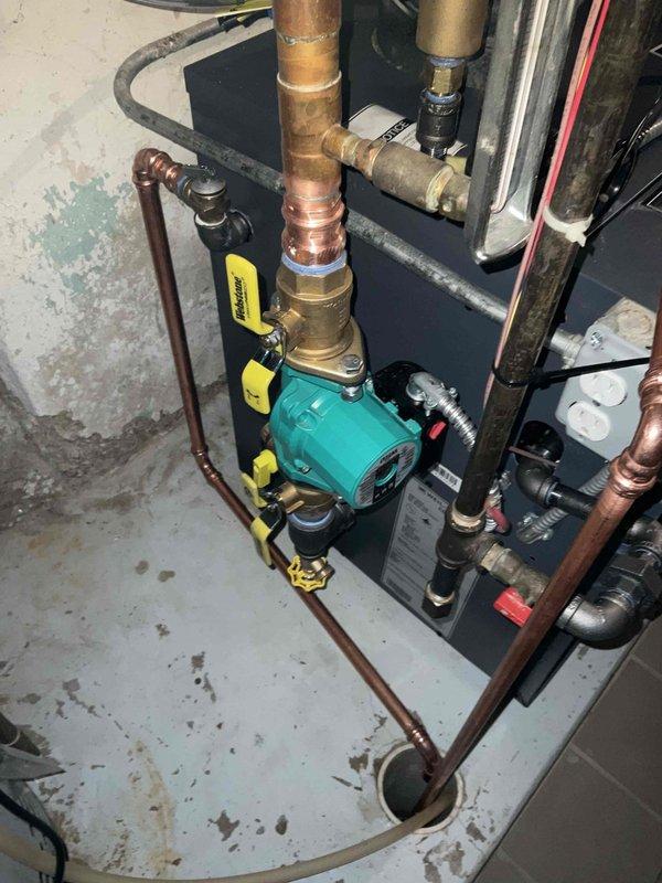 Successfully installed a Weil-McClain CGA 6 Series 4 cast iron boiler with #30 expansion tank, incorporating proper copper piping network with flow control valves and circulation pump. System integration included connection to an E100 dehumidifier, with all components tested and verified for optimal operation.