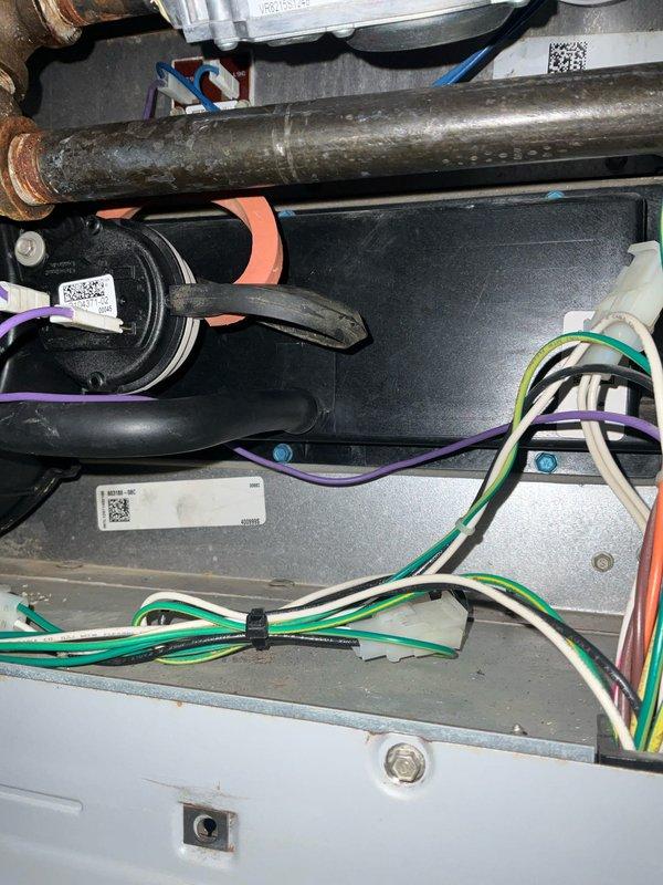 Successfully completed replacement of cold end header box in Lennox furnace, addressing visible corrosion and mineral deposits in the central port area. Unit was staged at headquarters prior to installation, with comprehensive photo documentation taken of the repair process.