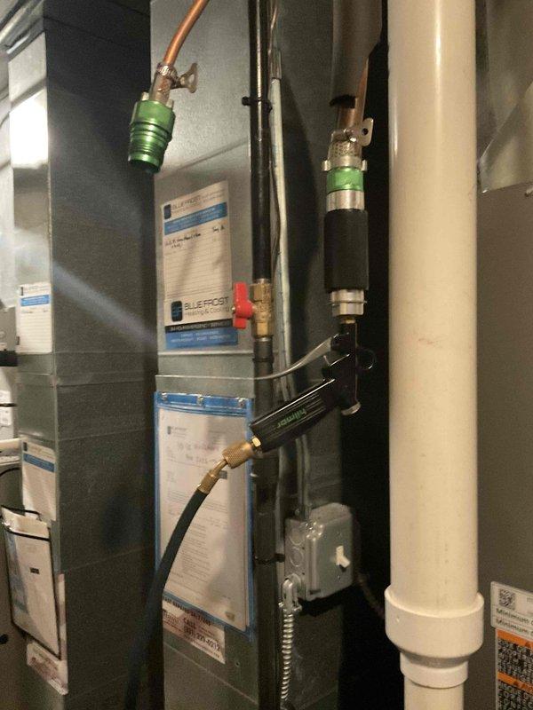 Successfully installed and commissioned new AC system. Completed all installation worksheet requirements and verified proper operation of system. Documented coil serial number and took reference photos of installation components including PVC drainage, copper refrigerant lines, and system connections.