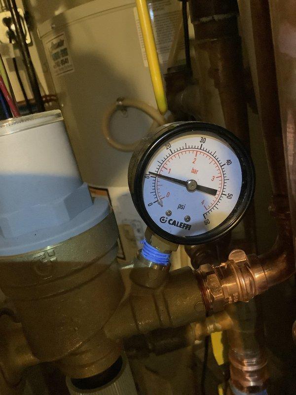 Responded to no heat call for recently installed boiler (2 days old). Upon inspection, found disconnected zoning and system pressure at approximately 40 PSI (significantly above normal operating range). Properly reconnected zoning system and adjusted pressure to manufacturer specifications, restoring heat function to residence.