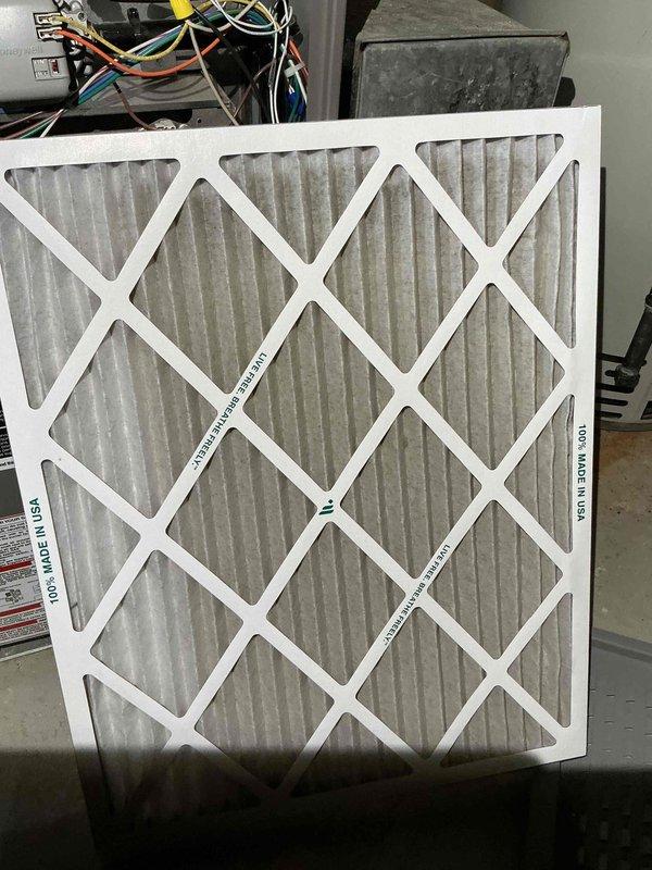 Performed standard maintenance tune-up on 14+ year old furnace system. Discovered significant dirt and debris accumulation in interior components requiring thorough cleaning. Replaced severely soiled air filter with new pleated filter to improve system efficiency and air quality.