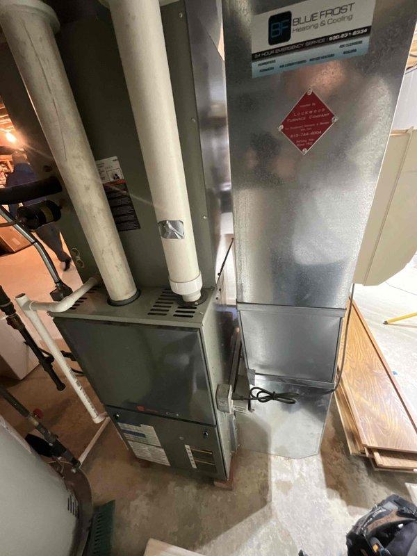 Conducted comprehensive sales estimate for complete HVAC system replacement in residential basement location. Evaluated existing furnace and air conditioning evaporator coil system for replacement recommendations. Assessed installation area, including concrete floor conditions, available workspace, electrical connections, and existing venting configuration with PVC drainage lines. Documented current Blue Frost branded equipment and surrounding utility infrastructure to determine proper sizing and configuration requirements for new system. Reviewed basement access points, ceiling joist clearances, and ductwork routing to ensure compatibility with proposed replacement equipment. New system equipment delivered to site and staged in basement work area for upcoming installation.