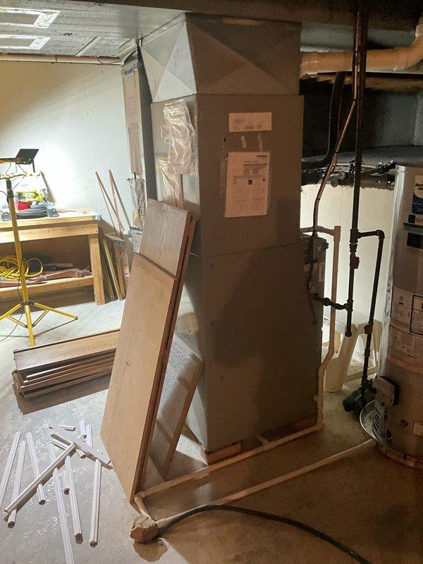 Conducted comprehensive sales estimate for complete HVAC system replacement in residential basement location. Evaluated existing furnace and air conditioning evaporator coil system for replacement recommendations. Assessed installation area, including concrete floor conditions, available workspace, electrical connections, and existing venting configuration with PVC drainage lines. Documented current Blue Frost branded equipment and surrounding utility infrastructure to determine proper sizing and configuration requirements for new system. Reviewed basement access points, ceiling joist clearances, and ductwork routing to ensure compatibility with proposed replacement equipment. New system equipment delivered to site and staged in basement work area for upcoming installation.