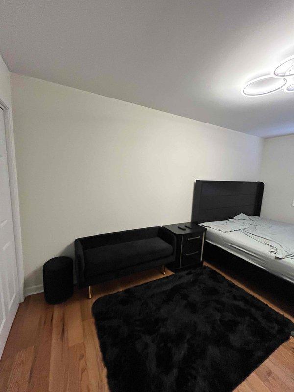 Conducted on-site assessment for mini split installation in residential bedroom. Evaluated room dimensions, existing electrical infrastructure, and optimal placement for indoor air handler unit on wall opposite bed area. Documented installation location and confirmed feasibility for ductless heat pump system to provide heating and cooling to the space.