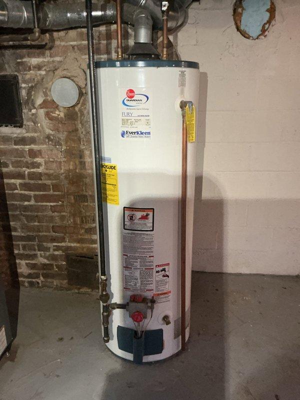 Installed a 50-gallon Guardian residential gas water heater, model BFRG250T6N, equipped with a powered anode rod for enhanced corrosion protection. Connected all necessary copper supply lines, gas piping, and venting components, ensuring proper clearances and code-compliant installation in the basement utility area. Verified all connections for leaks, tested unit operation, and confirmed proper temperature and pressure relief valve functionality.