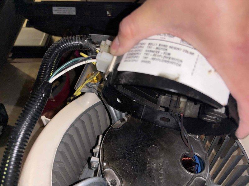 Responded to service call for burning smell from furnace heating basement and first floor. Upon inspection, identified failed blower motor assembly as source of odor. Removed defective motor and installed new Genteq replacement blower motor with proper mounting brackets and electrical connections. Tested system operation and verified proper airflow with no abnormal odors present.