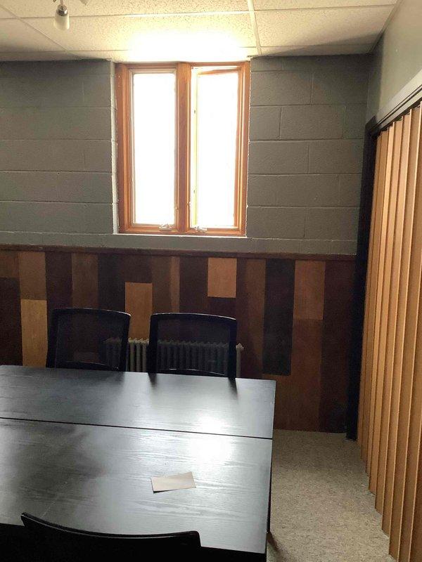 Conducted commercial HVAC sales estimate for air conditioning system and coil replacement at office facility. Documented existing interior conditions including reception area, conference room, and building infrastructure to assess equipment access points and installation requirements for proposed A/C and coil system upgrade.
