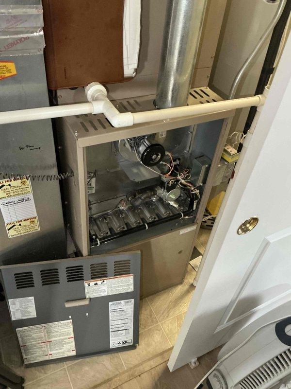 Completed full HVAC system installation in residential utility closet, including Lennox SL280UH110V60C 80% AFUE two-stage variable speed gas furnace rated at 110,000 BTU input, Lennox ML13KC1-036 13 SEER air conditioning unit with 3-ton capacity, and CK40CT-30/36C evaporator coil. Installed Ecobee smart thermostat with proper wiring and programming for two-stage heating and single-stage cooling operation. Configured all ductwork connections, established proper condensate drainage system using PVC piping, verified gas line connections and combustion air requirements, tested all electrical connections, and commissioned system to manufacturer specifications with successful startup of both heating and cooling modes.