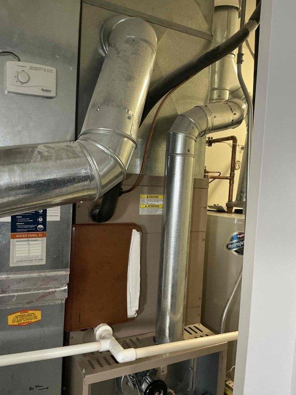 Completed full HVAC system installation in residential utility closet, including Lennox SL280UH110V60C 80% AFUE two-stage variable speed gas furnace rated at 110,000 BTU input, Lennox ML13KC1-036 13 SEER air conditioning unit with 3-ton capacity, and CK40CT-30/36C evaporator coil. Installed Ecobee smart thermostat with proper wiring and programming for two-stage heating and single-stage cooling operation. Configured all ductwork connections, established proper condensate drainage system using PVC piping, verified gas line connections and combustion air requirements, tested all electrical connections, and commissioned system to manufacturer specifications with successful startup of both heating and cooling modes.