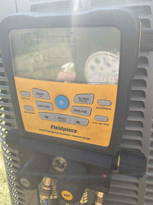 Completed air conditioning installation and system startup for Lennox ML1KC1-036 outdoor condensing unit with previously installed evaporator coil. Set up outdoor unit on concrete pad, connected refrigerant lines and electrical conduit, and performed comprehensive system startup procedures using Fieldpiece SMAN digital manifold to verify proper refrigerant pressures, temperatures, and overall system operation.