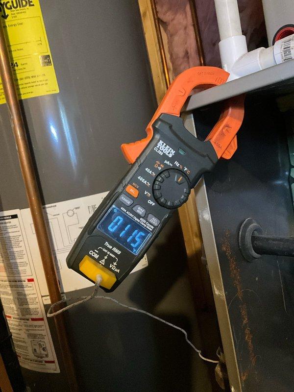 Responded to service call for furnace malfunction initially suspected to be thermostat-related. Customer had contacted Ecobee support who indicated potential high limit switch issue with the heating system. Upon arrival, performed diagnostic inspection of furnace unit located in basement mechanical room. Conducted electrical testing using clamp meter to verify current draw and system operation. Inspected high limit switch, safety controls, and associated wiring. Examined furnace operation through complete heating cycle to assess component functionality. Documented equipment condition and diagnostic findings with photographs of furnace installation and electrical measurements for service records.