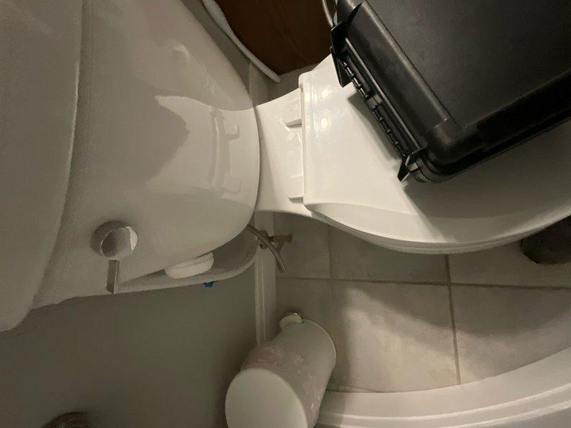 Completed comprehensive plumbing inspection as part of Building Facilities Maintenance Agreement tune-up service. Performed thorough evaluation of bathroom fixtures including toilet installation, supply lines, shut-off valves, and floor mounting integrity. Inspected water heater system in utility area, examining copper piping connections, pressure relief valve operation, and overall unit condition. All plumbing components found to be functioning properly with no leaks or immediate concerns identified.