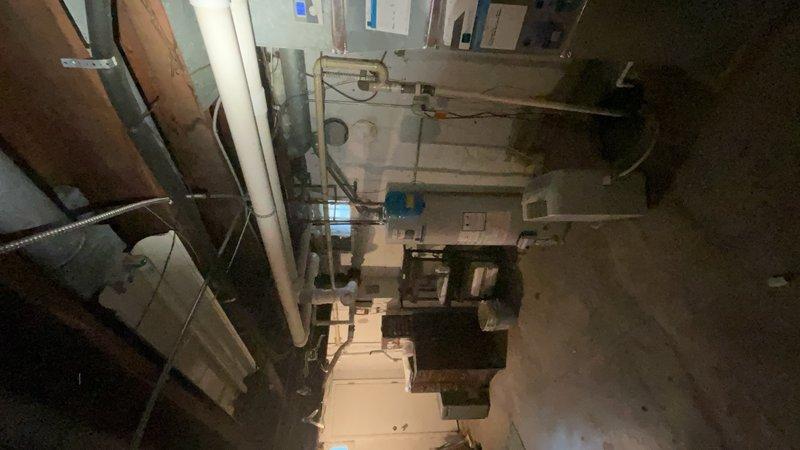 Completed comprehensive HVAC maintenance tune-up at residential property, performing full system inspection of heating and cooling equipment located in basement utility area. Verified proper operation of all mechanical components, checked refrigerant levels, inspected ductwork and PVC condensate drain lines, tested thermostat functionality, and examined electrical connections at control panels. All HVAC systems found to be operating within normal parameters following standard preventive maintenance protocol.