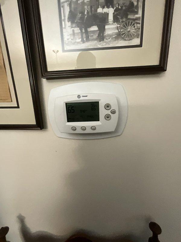 Completed comprehensive BFMA furnace tune-up on 9+ year old heating system, including full inspection, cleaning, and performance testing of all components. Verified proper operation of Trane thermostat with temperature settings displaying correctly at 85 degrees. All safety controls, burner assembly, heat exchanger, and blower components inspected and found operating within manufacturer specifications for continued reliable heating performance.