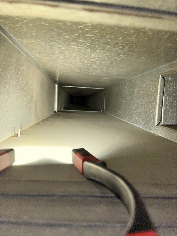 Completed comprehensive duct cleaning service for 4th floor condo unit using electric compressor and large vacuum system. Performed thorough cleaning of rectangular metal ductwork, removing accumulated dust, debris, and allergens from all accessible sections. Inspected interior duct surfaces and branch connections to ensure proper airflow and system efficiency throughout the HVAC system.