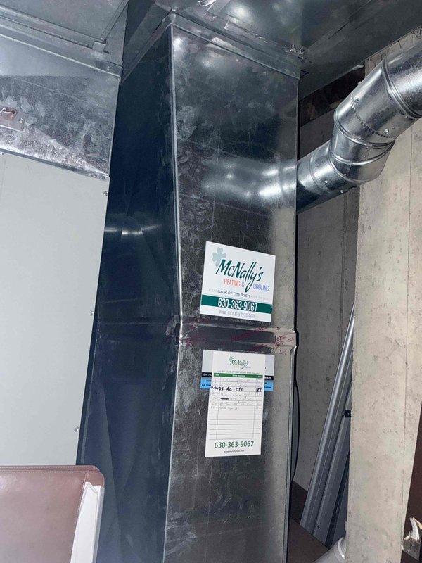 Conducted HVAC assessment for residential air conditioning system replacement. Customer expressed interest in replacement options for existing 15-year-old system. Evaluated indoor furnace unit located in basement mechanical room showing age-related wear, and inspected outdoor condenser unit positioned against exterior wall near chimney. Documented current equipment condition and configuration including ductwork connections and electrical service. Prepared comprehensive replacement estimate presenting multiple air conditioning and coil upgrade options to improve system efficiency and reliability.