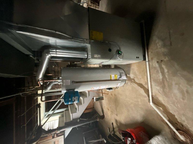 Installed 40-gallon domestic water heater in residential basement mechanical room. Removed existing well anode rod and replaced with electric anode rod to address water odor issue as recommended by water quality specialist. Installation included proper connections to copper supply lines with shutoff valves, venting ductwork, and electrical components. All components tested and verified operational upon completion.