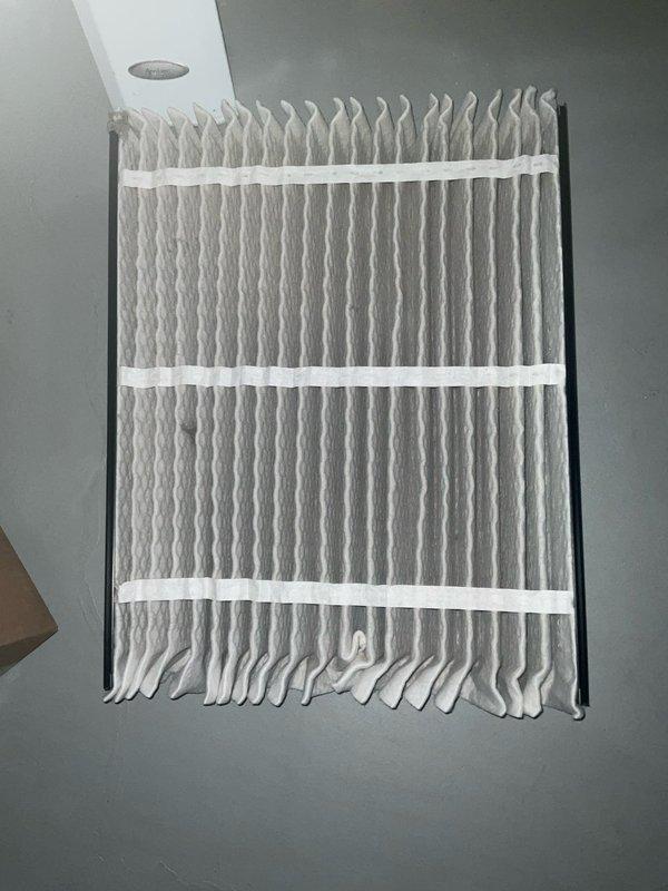 Completed spring AC tune-up and preventative maintenance inspection for Bluefrost member. Inspected and serviced air conditioning system, verified all components operating within normal parameters. Replaced air filter with new pleated media filter to ensure proper airflow and system efficiency. Documented sump pump installation and associated drainage system in basement utility area, noting proper operation of pump mechanism and PVC piping configuration. All systems tested and confirmed operational.