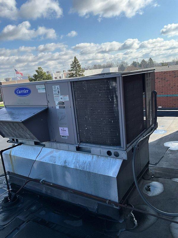 Completed preventive maintenance tune-up on two Carrier rooftop package units as part of recurring BFMA service agreement. Performed comprehensive inspection of both 9-year-old RTU systems including blower assembly, centrifugal fan operation, ductwork connections, and refrigerant lines. Verified proper operation of all mechanical components, checked condenser coil condition through mesh grille access, and confirmed secure mounting on rooftop curb adapters. All systems operating within normal parameters with no immediate repairs required.