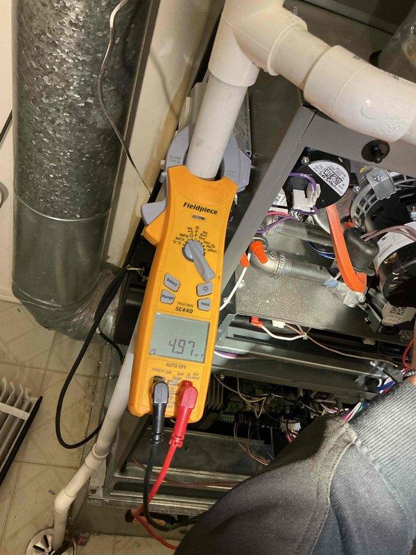 Completed comprehensive tune-up on Lennox SL280UH070V36A-09 furnace (manufactured 04/2025) with input ratings of 65,000 BTU. Performed diagnostic testing using digital multimeter to verify electrical specifications at 115V and measured system performance parameters. Inspected blower motor assembly, verified proper manifold pressure, confirmed temperature rise within manufacturer specifications of 40-70°F, and documented all system components operating within normal parameters.