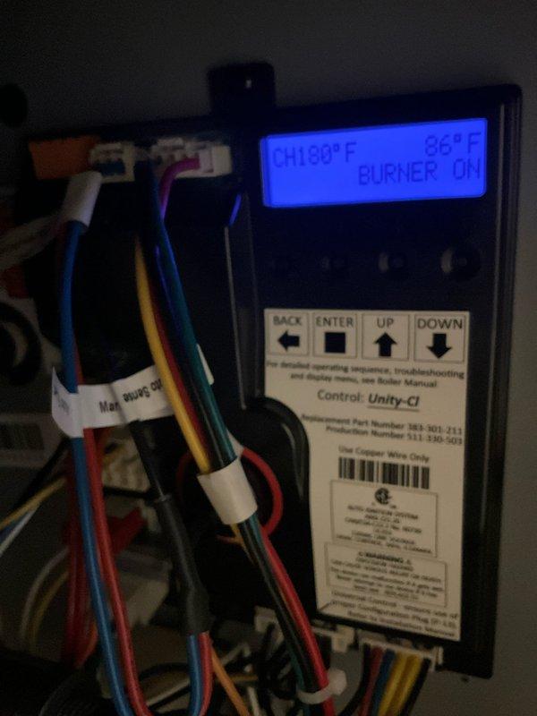 Responded to service call for non-operational boiler system. Upon arrival, performed diagnostic assessment of recently installed heating unit and associated controls. Inspected Unity-CI control panel displaying operational parameters including temperature readings of 141.0°F and burner firing rate at 94%, indicating system was functioning at time of inspection. Verified all electrical connections, control wiring, and safety interlocks were properly secured and operational. Examined boiler installation including copper piping connections, pressure gauge readings, expansion tank, and associated plumbing infrastructure. System tested and confirmed operational with burner cycling properly and achieving target temperatures. Provided operational guidance to homeowner regarding normal system functions and display readings.