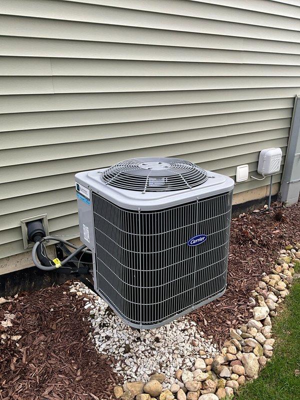 Completed comprehensive BFMA tune-up service on a Carrier air conditioning system over 5 years old during afternoon appointment window. Performed full AC tune-up including inspection of outdoor condenser unit, verified proper electrical connections and conduit integrity, assessed drainage and gravel base installation, and replaced 16x25x1 air filter. All components found operating within normal parameters with no immediate repairs required.