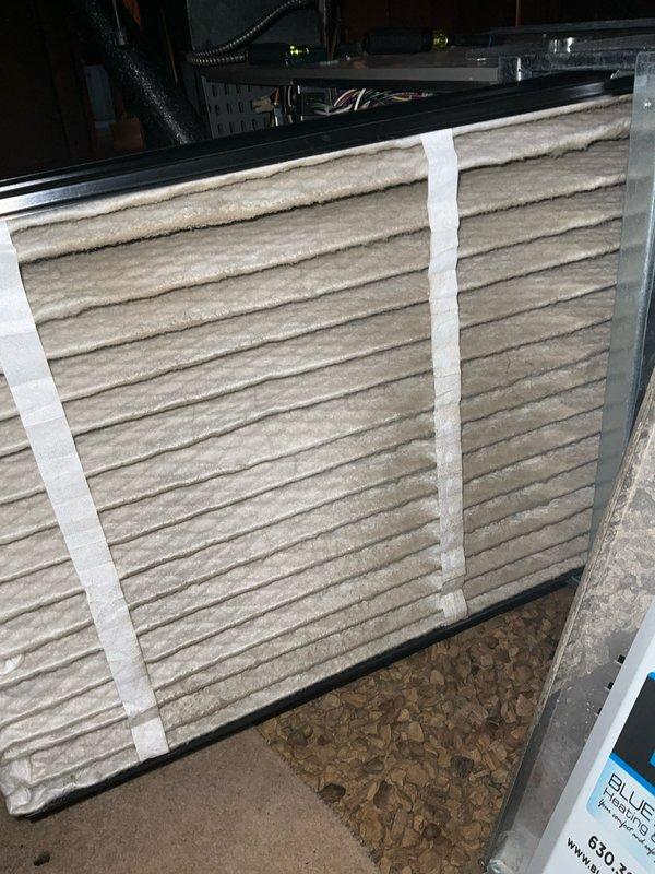 Completed comprehensive BFMA tune-up on 26-year-old residential HVAC system located in attic space. Discovered heavily soiled air filter with significant accumulation of dust, debris, and wood particulate matter restricting airflow; replaced filter to restore proper system ventilation and efficiency. Performed standard maintenance inspection of horizontal air handler unit, checked blower motor assembly, verified electrical connections, inspected ductwork and refrigerant lines, and confirmed all mechanical components operating within normal parameters.