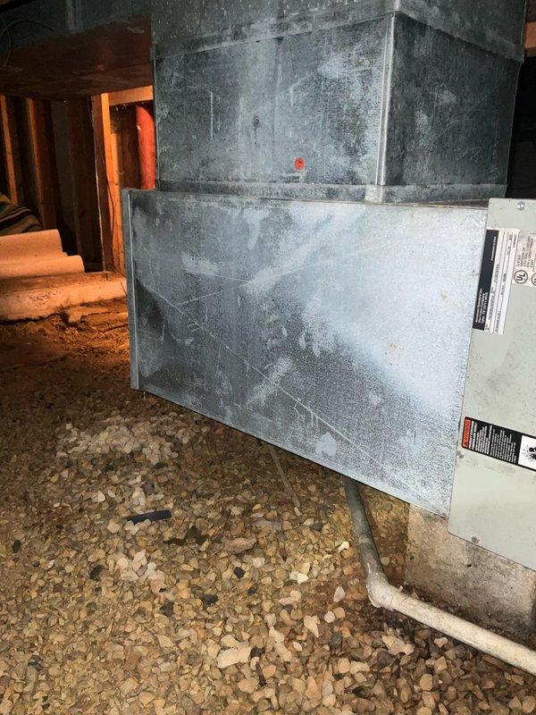 Conducted comprehensive sales estimate for complete air conditioning system replacement including outdoor condenser unit and indoor evaporator coil. Evaluated existing aged outdoor condensing unit showing significant weathering, surface discoloration, and deterioration. Inspected attic-mounted air handler and evaporator coil assembly, assessed existing ductwork connections and insulation conditions. Documented equipment specifications, measured existing system configuration, and photographed current installation for proper sizing and replacement recommendations.