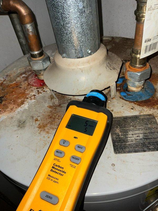 Responded to after-hours call for non-operational furnace less than one year old. Upon arrival, conducted comprehensive system inspection including visual assessment of ductwork and heating equipment. Performed carbon monoxide safety testing at water heater and heating system components, with readings within safe parameters (5 ppm). Documented existing conditions including significant rust corrosion at galvanized ductwork connection points and seams, particularly at horizontal-to-vertical duct junction. Noted weathered galvanized coating and moisture damage indicators throughout duct system. Inspected water heater installation area, copper piping connections, and associated mechanical components. Equipment remains under warranty coverage for potential repair costs.