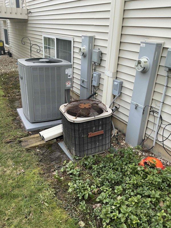Conducted comprehensive site evaluation for complete HVAC system replacement including air conditioning and furnace units. Assessed existing outdoor equipment configuration consisting of one older black cylindrical condensing unit and one newer gray vertical unit, both positioned on concrete pads against exterior wall with established electrical infrastructure including meters, disconnects, and conduit routing. Documented current system conditions showing weathering, age-related deterioration, and moisture accumulation on exterior components. Evaluated electrical service capacity, existing line set routing, and installation accessibility for proposed equipment upgrades. Prepared detailed estimate for full system replacement to meet client heating and cooling requirements.