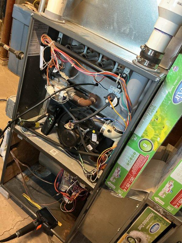 Completed comprehensive furnace tune-up on 16-year-old unit in response to customer concern regarding unusual odor during operation. Performed full system inspection with access panel removal to examine internal components including blower motor assembly, heat exchanger, electrical connections, and ductwork. Utilized borescope camera to conduct detailed internal inspection of heat exchanger for cracks, corrosion, or deterioration that could cause odor issues or safety concerns. All mechanical and electrical components inspected and found to be functioning within normal parameters. System tested and verified operational.