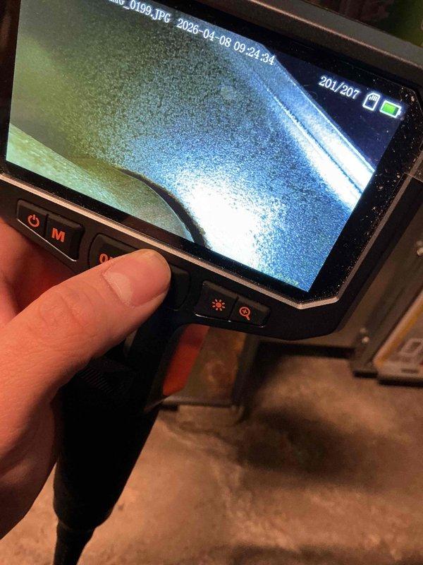 Completed comprehensive furnace tune-up on 16-year-old unit in response to customer concern regarding unusual odor during operation. Performed full system inspection with access panel removal to examine internal components including blower motor assembly, heat exchanger, electrical connections, and ductwork. Utilized borescope camera to conduct detailed internal inspection of heat exchanger for cracks, corrosion, or deterioration that could cause odor issues or safety concerns. All mechanical and electrical components inspected and found to be functioning within normal parameters. System tested and verified operational.