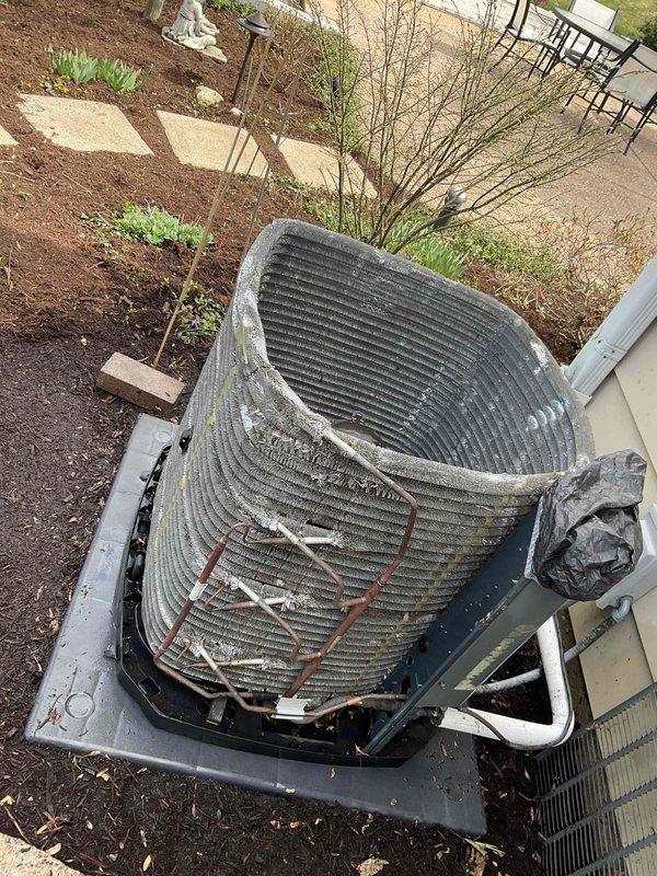 # BFMA Tune Up - Dual AC System Maintenance

Completed comprehensive BFMA tune-up service on two residential air conditioning systems, ages 7 and 11 years. Performed maintenance on Trane XR model outdoor condenser unit, which showed moderate exterior soiling and weathering consistent with age. Removed top cover to access internal components and inspected cylindrical condenser coil assembly, which exhibited heavy accumulation of dirt, dust, and debris between fins throughout the coil surfaces.

Cleaned condenser coils to remove environmental contaminants and restore proper airflow through fin spaces. Performed standard tune-up procedures including electrical connection inspection, refrigerant level verification, capacitor testing, and operational testing of both systems. Verified proper amperage draw on compressor and fan motor. Checked thermostat calibration and system cycling. Both units returned to normal operating parameters following maintenance procedures.

Documented equipment co