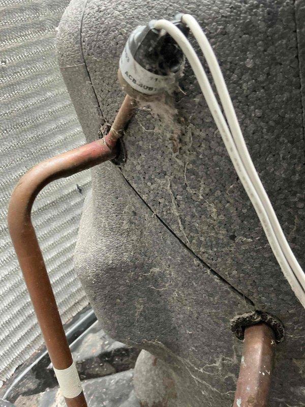 Completed comprehensive BFMA tune-up service on two residential air conditioning systems aged 4 and 7 years. Performed standard preventive maintenance procedures including inspection of refrigerant lines, electrical connections, and condensing unit components on both systems. Inspected outdoor unit revealing weathered insulation on suction line, accumulated debris in condensing unit compartment, and minor surface corrosion on metal housing components; cleaned unit and verified all mechanical components operating within normal parameters. Evaluated refrigerant line connections at wall penetration points, confirmed proper insulation integrity on copper lines and white insulated suction lines, and verified secure mounting of all HVAC components. Service completed within customer's required timeframe with all systems tested and operational.