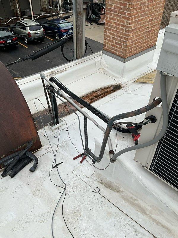 Replaced failed condenser fan motor and blade assembly on Lennox unit serial number 5803C14708. Reused existing motor mount bracket, installed new motor with blade, and replaced deteriorated suction line insulation to restore proper system operation and prevent future refrigerant line sweating.