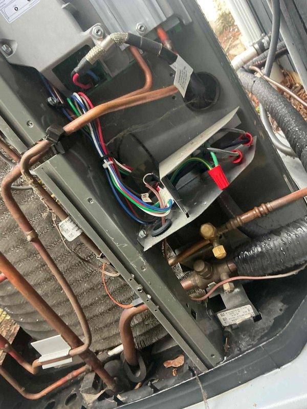 Completed comprehensive BFMA tune-up service on a one-year-old outdoor AC condenser unit. Performed full system inspection including examination of refrigerant lines, electrical connections, compressor components, and condenser coil condition. All copper refrigerant lines, electrical wiring, relays, and mechanical components were inspected and found to be operating within normal parameters with typical oxidation present on copper tubing consistent with equipment age.