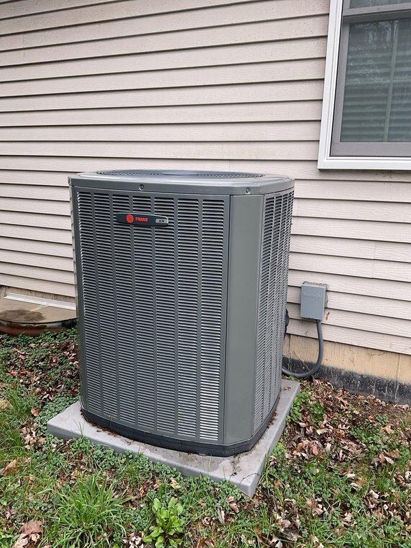 Completed non-member air conditioning tune-up on a 3-year-old Trane outdoor condensing unit. Performed comprehensive system inspection including visual examination of exterior cabinet condition, electrical disconnect, refrigerant lines, and concrete pad placement. Accessed electrical compartment to inspect dual-run capacitor, contactor, wiring connections, and wire terminals for proper operation and secure connections. All components found in good working condition with no immediate repairs needed. System operating within normal parameters.