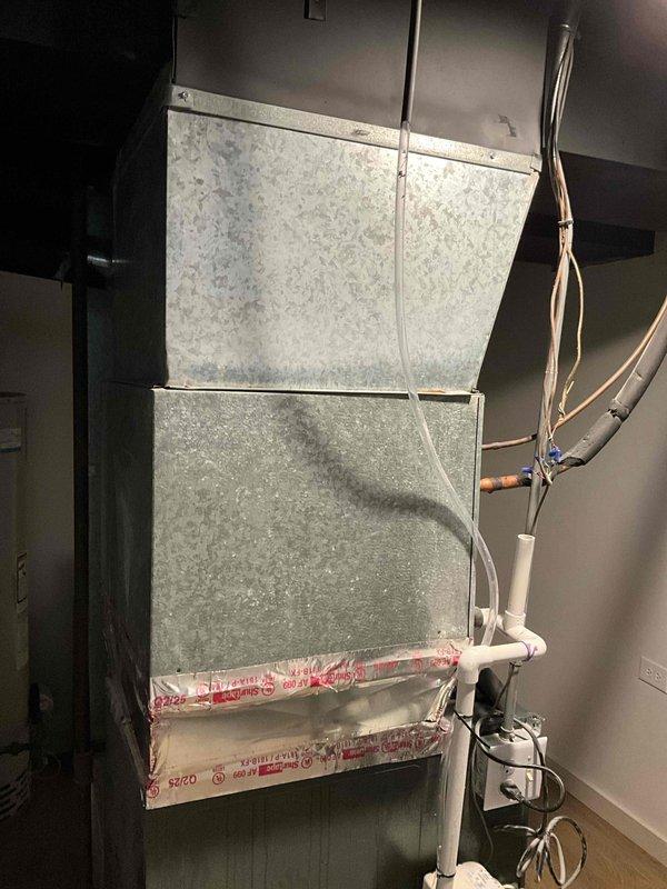 Completed installation of Lennox ML13KC1-030 air conditioning condenser unit and 17.5 SEER cased evaporator coil with P200 condensate pump. Protected work area with drop cloths on stairway during equipment installation, installed air handler with coil in indoor mechanical closet, connected flexible ductwork, and established proper condensate drainage system. All components tested and operational upon completion.