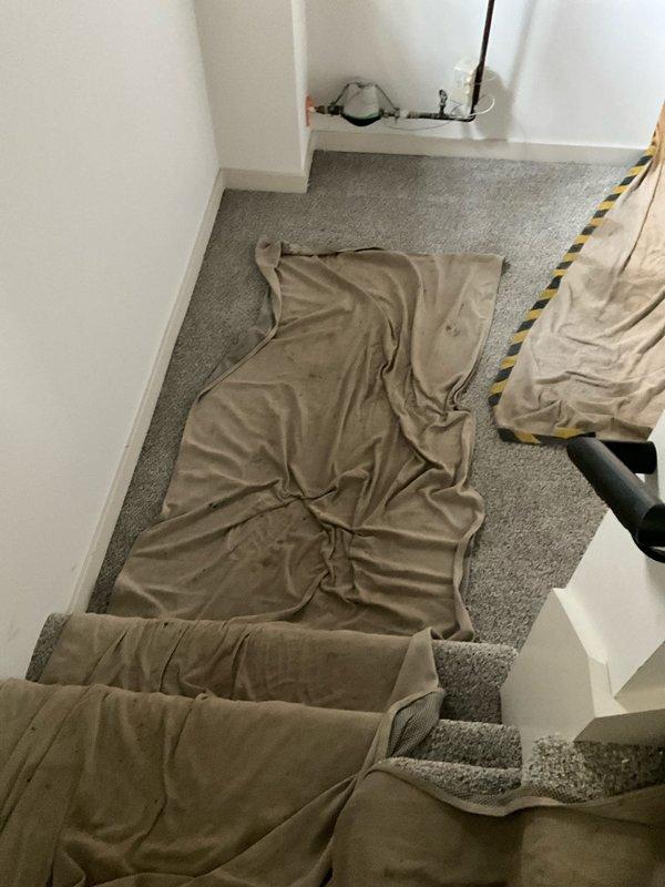 Completed installation of Lennox ML13KC1-030 air conditioning condenser unit and 17.5 SEER cased evaporator coil with P200 condensate pump. Protected work area with drop cloths on stairway during equipment installation, installed air handler with coil in indoor mechanical closet, connected flexible ductwork, and established proper condensate drainage system. All components tested and operational upon completion.