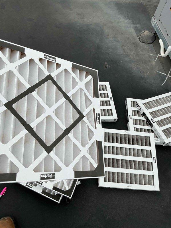 Completed comprehensive BFMA tune-up service on 15-year-old rooftop unit including full AC system inspection and filter replacement. Performed electrical diagnostics using clamp meter, recording amperage readings to verify proper compressor operation and system performance. Replaced multiple air filters of various sizes throughout the system, removing accumulated dust and debris to restore proper airflow and system efficiency.