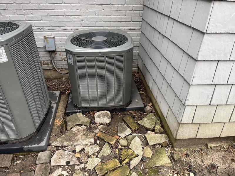 Completed comprehensive BFMA preventive maintenance tune-up on residential air conditioning system. Performed thorough inspection of outdoor condenser unit, noting moderate dust and debris accumulation on finned heat exchanger coil requiring cleaning. Cleaned condenser coils to restore optimal airflow and heat transfer efficiency, removing dirt, grime, and environmental debris lodged between aluminum fins. Verified proper operation of condenser fan motor and compressor, inspected refrigerant lines and electrical connections, and confirmed unit mounted securely on concrete pad. System operating within normal parameters upon completion of maintenance service.